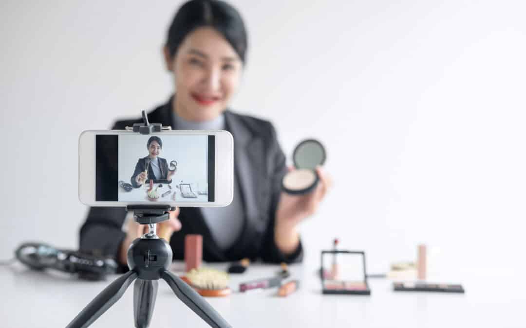 In this article that shares how to use video for marketing, this image shows a woman in front of a video camera filming herself.